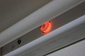 The typical glow of an automatic glow starter while lighting up a fluorescent lamp