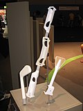 Small golf club-, bow- and arrowdummy at Gamescom 2009 in which the Wii Remote can be inserted