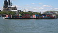 A riverboat shipping containers on the Rhine in Cologne (Germany)