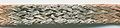 A solder wick soaked with solder. The black spots are impurities.